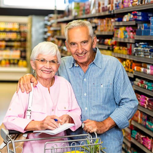 Senior couple happily shopping for clothing and home decor at Ross store