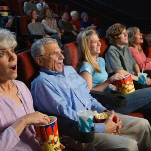 Seniors Enjoying Movie in Theatre 