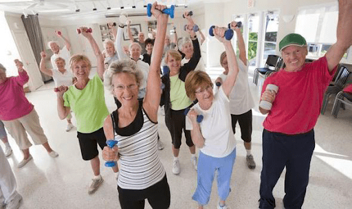 Senior people exercising with light dumbbells 